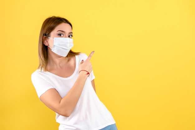 front-view-young-woman-mask-yellow-wall_179666-15125